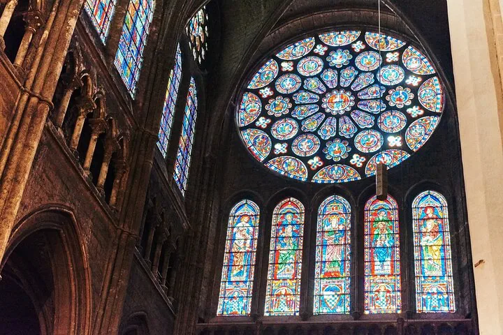 Interior view of Chartres Cathedral showcasing a large rose window